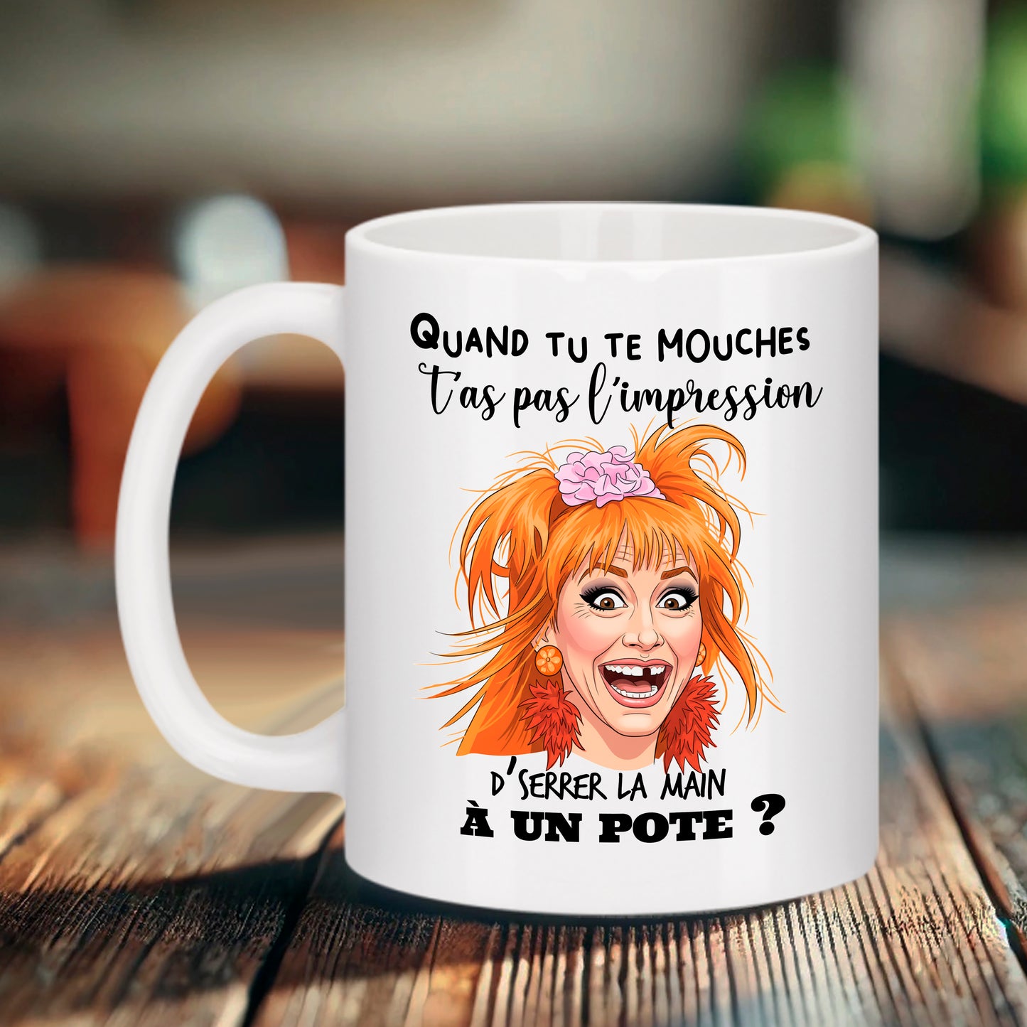 Mug blanc Bruhle avec une caricature de Dame Ginette des Visiteurs, cheveux orange et dents du bonheur, texte : Quand tu te mouches t’as pas l’impression d’serrer la main à un pote ?