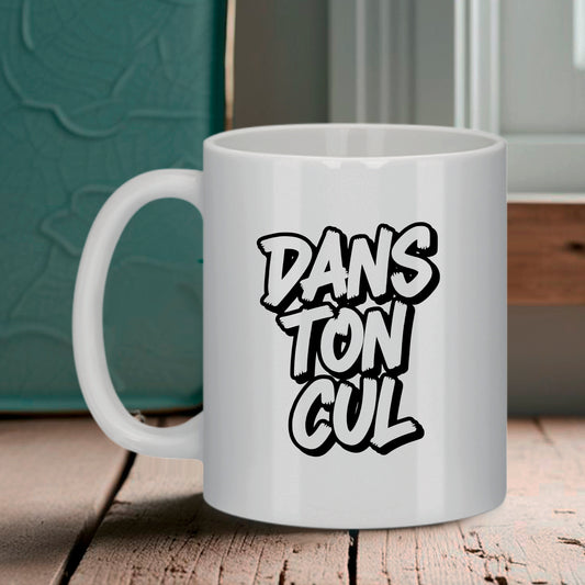 Tasse blanche Bruhle avec le texte DANS TON CUL écrit en grosses lettres noires style graffiti.